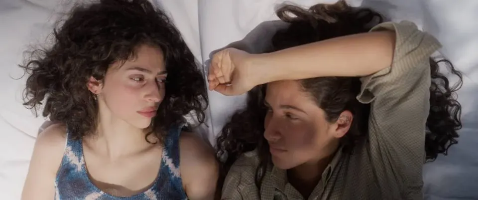 Still from Summer Vision: two women lying side by side